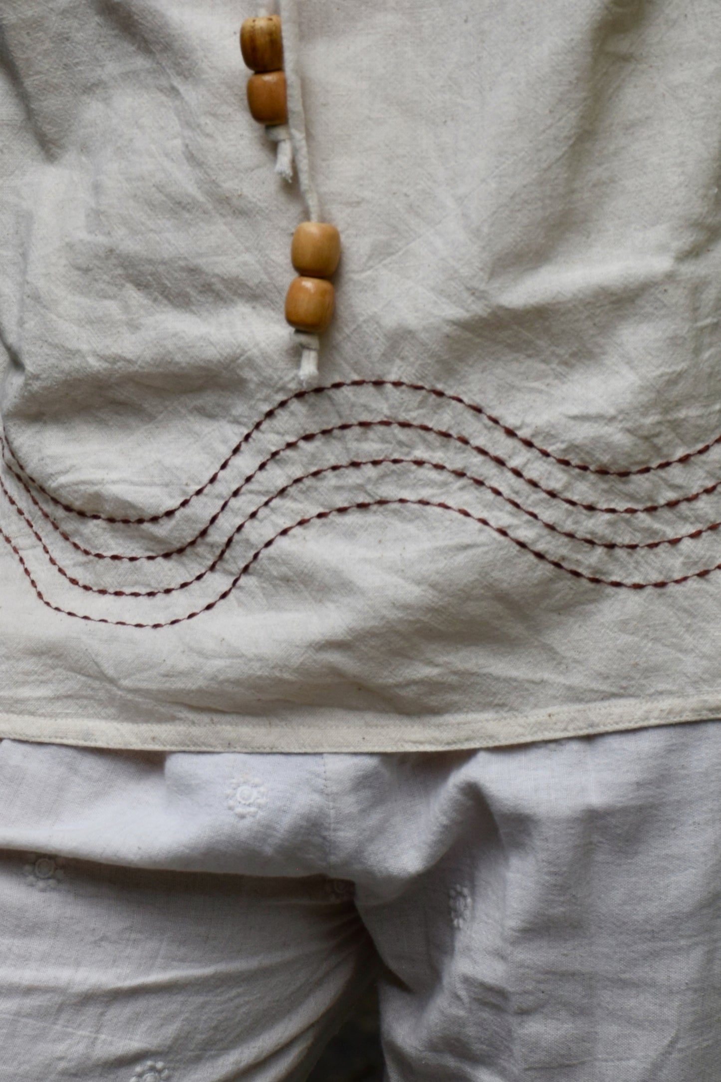 "Saaz" - Beige cotton adjustable neckline top with natural wooden beads and wave embroidery