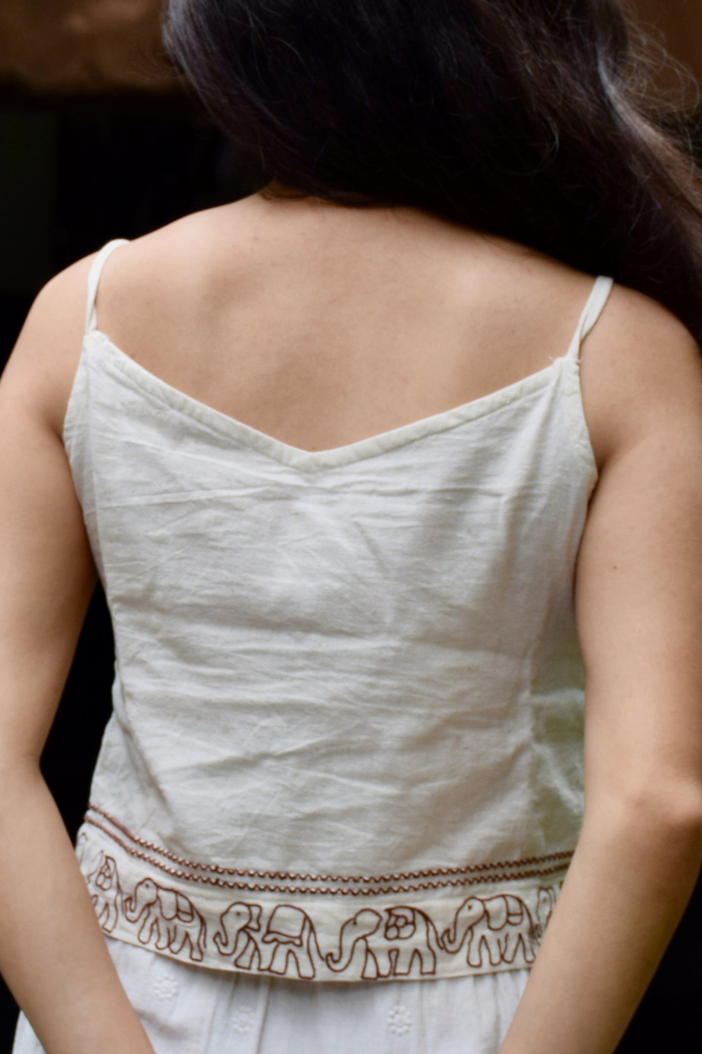 "Ban Ki Rani" - Cotton sleeveless elephant embroidery v neck top with wooden beads